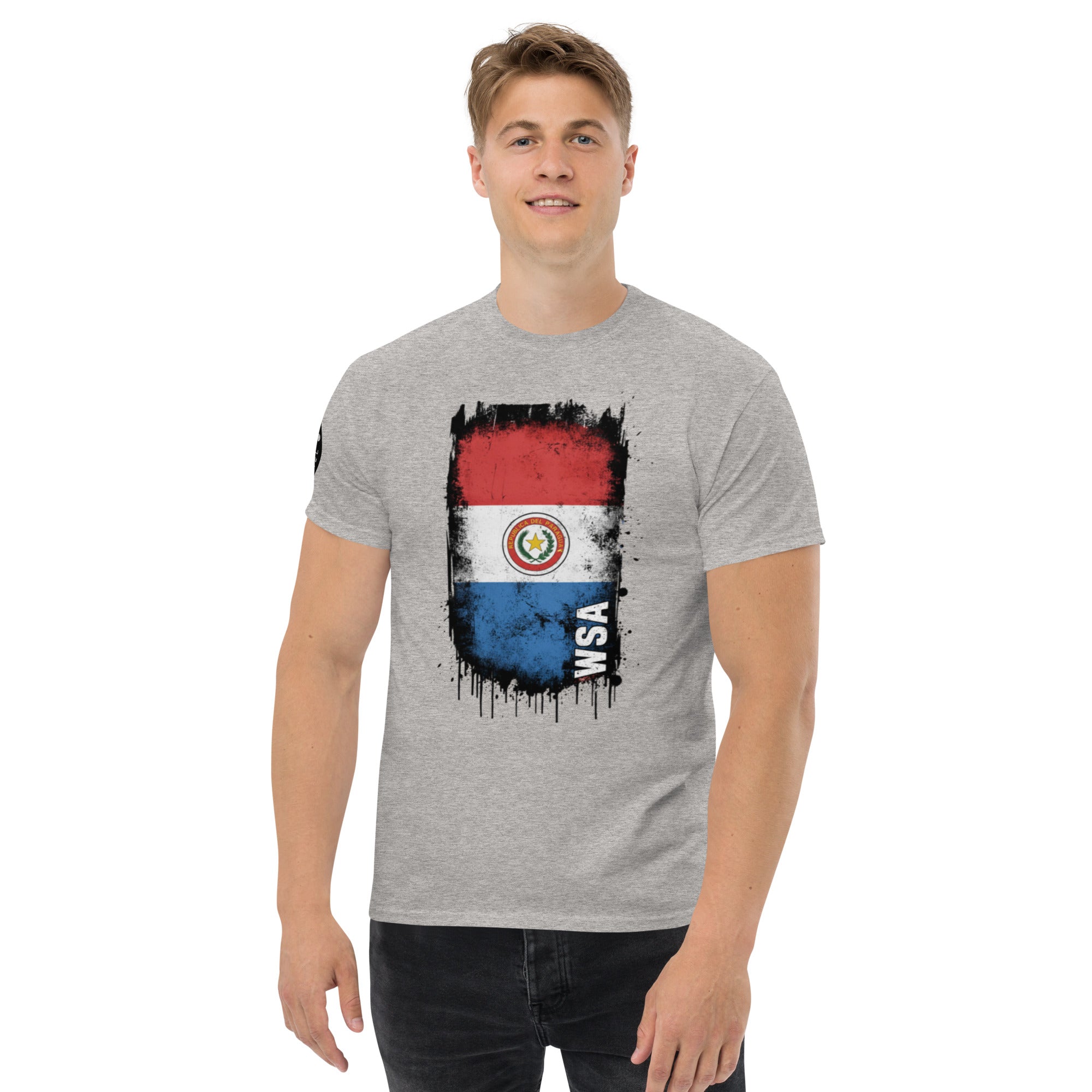 Person wearing a gray t-shirt with a flag design on a white background