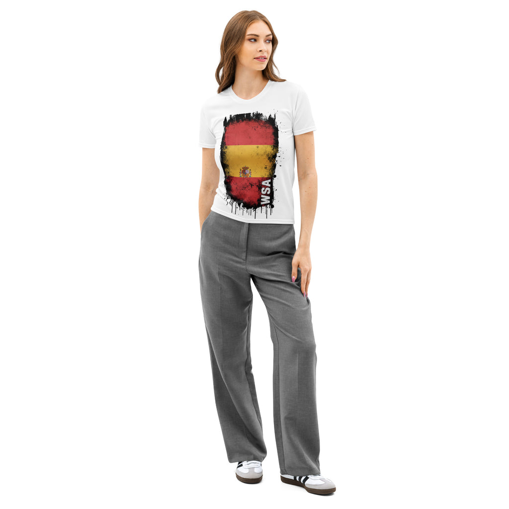 Woman wearing a white t-shirt with a colorful graphic design and gray pants on a white background