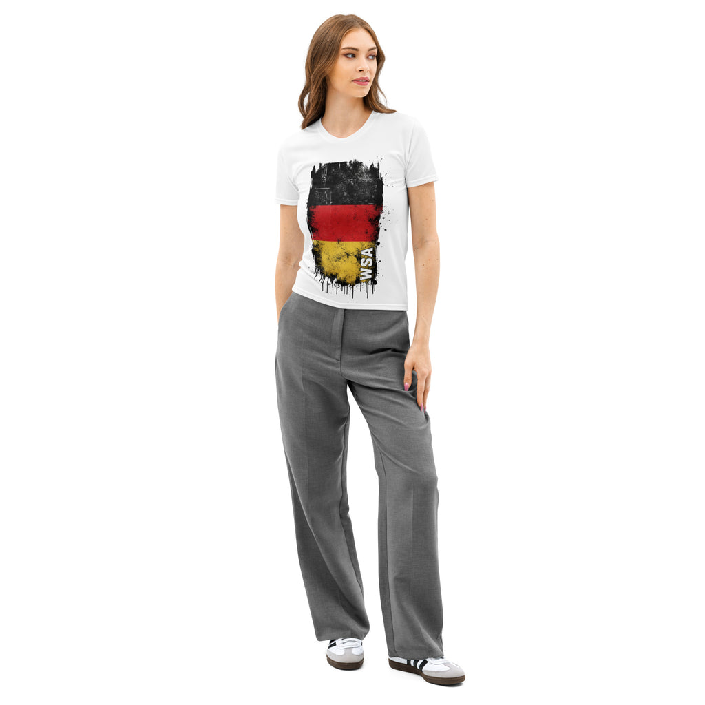 Woman wearing a white t-shirt with a graphic design and gray pants on a white background