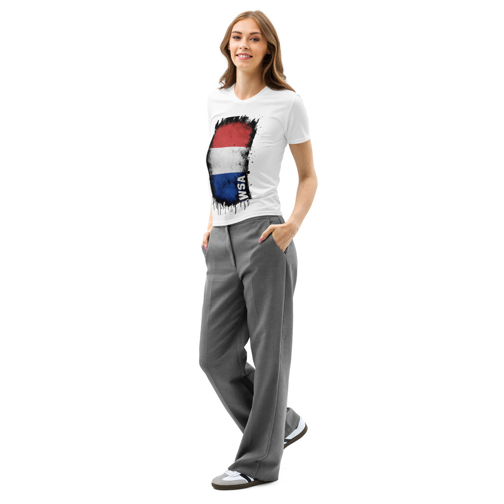 Woman wearing a white t-shirt with a colorful design and gray pants on a white background