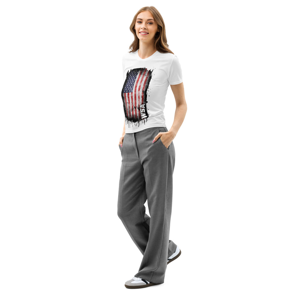 Woman wearing a white t-shirt with a graphic design and gray pants on a white background