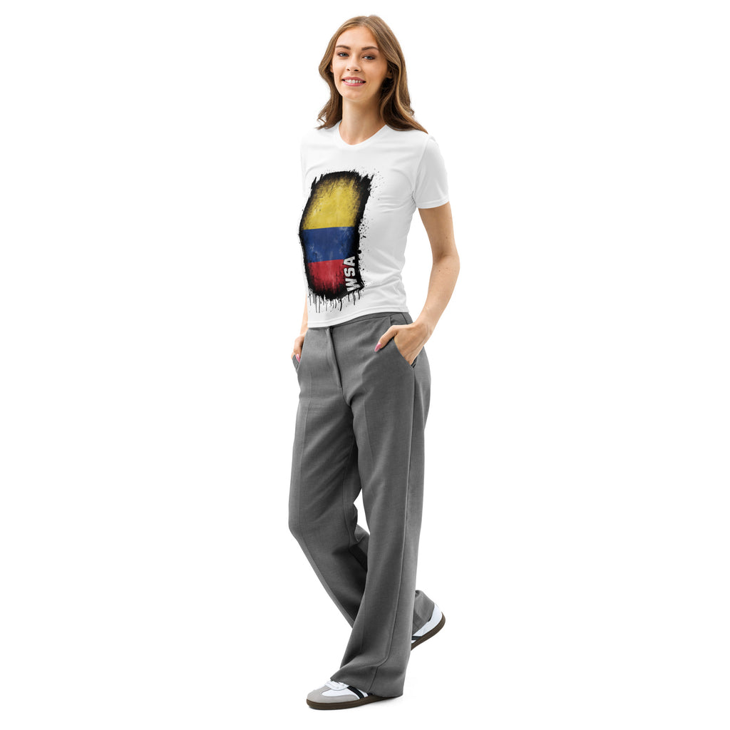 Woman wearing a white t-shirt with a colorful design and gray pants on a white background