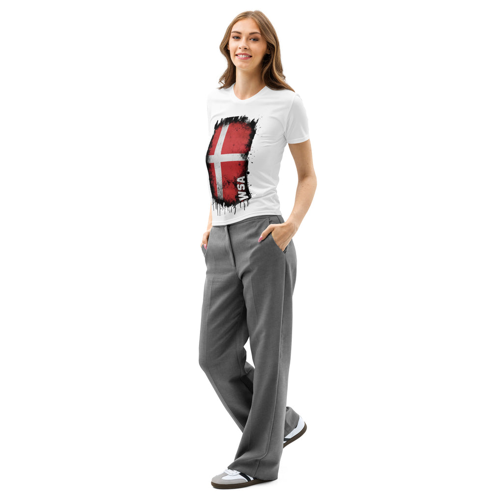 Woman wearing a white t-shirt with a graphic design and gray pants on a white background