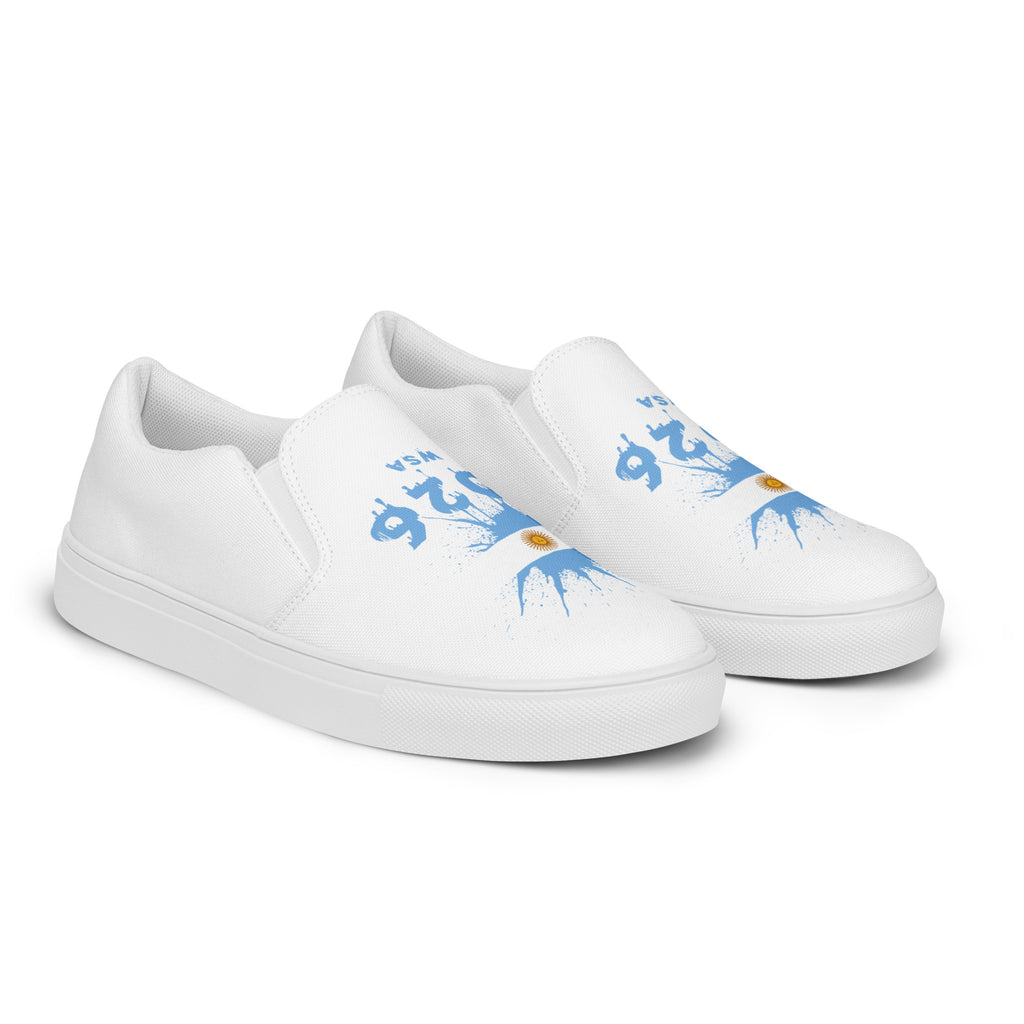 White slip-on sneakers with blue designs on a white background