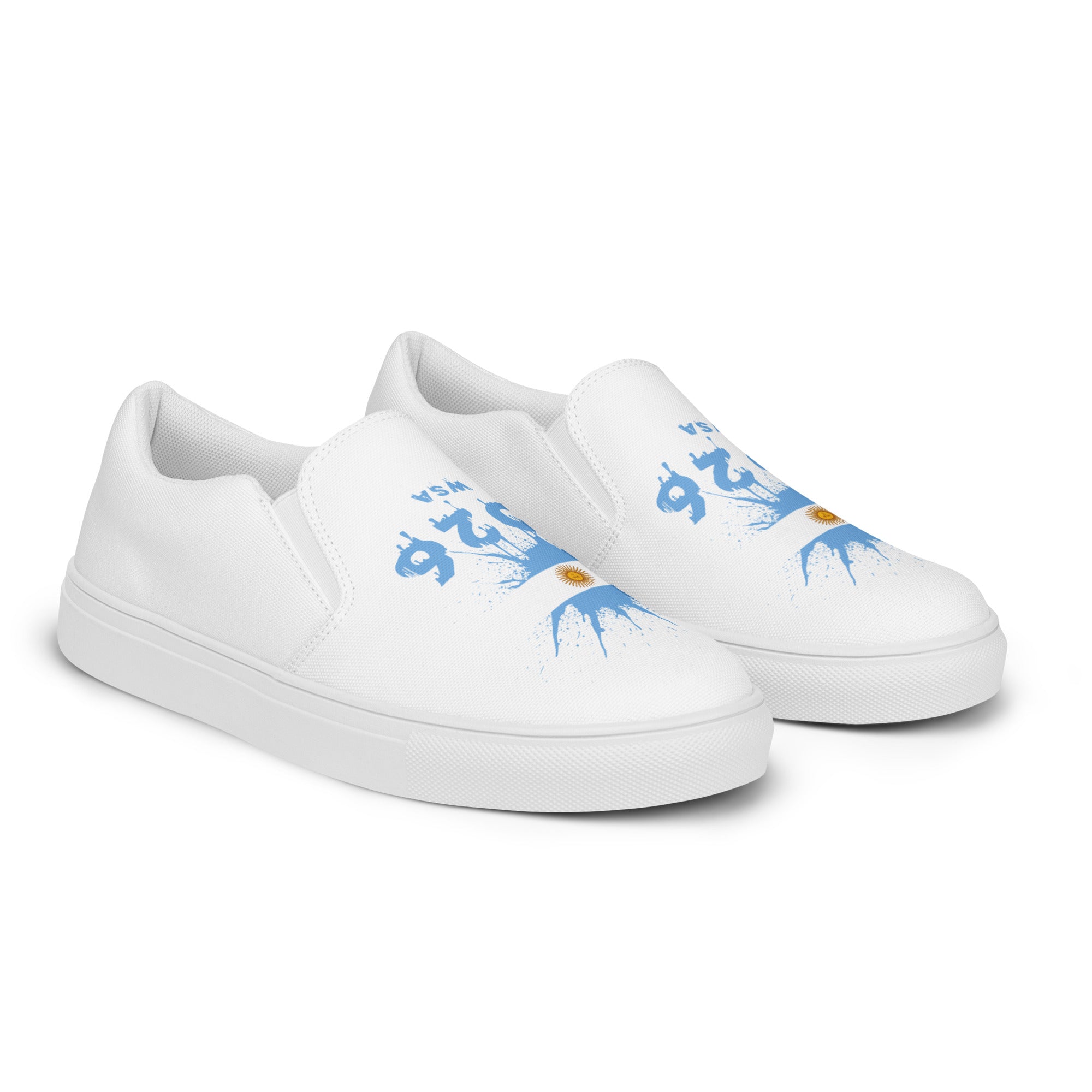 White slip-on sneakers with blue designs on a white background