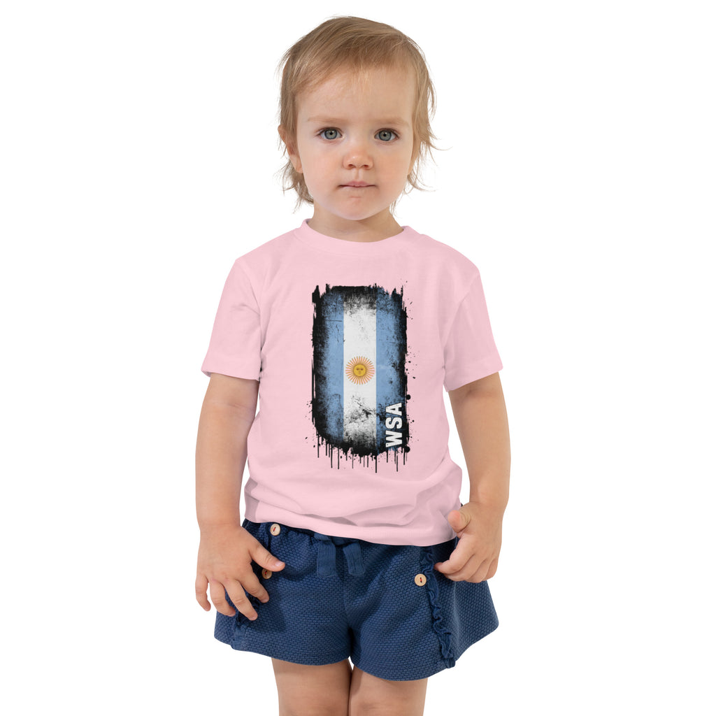 Child wearing a pink t-shirt with a graphic design on a white background