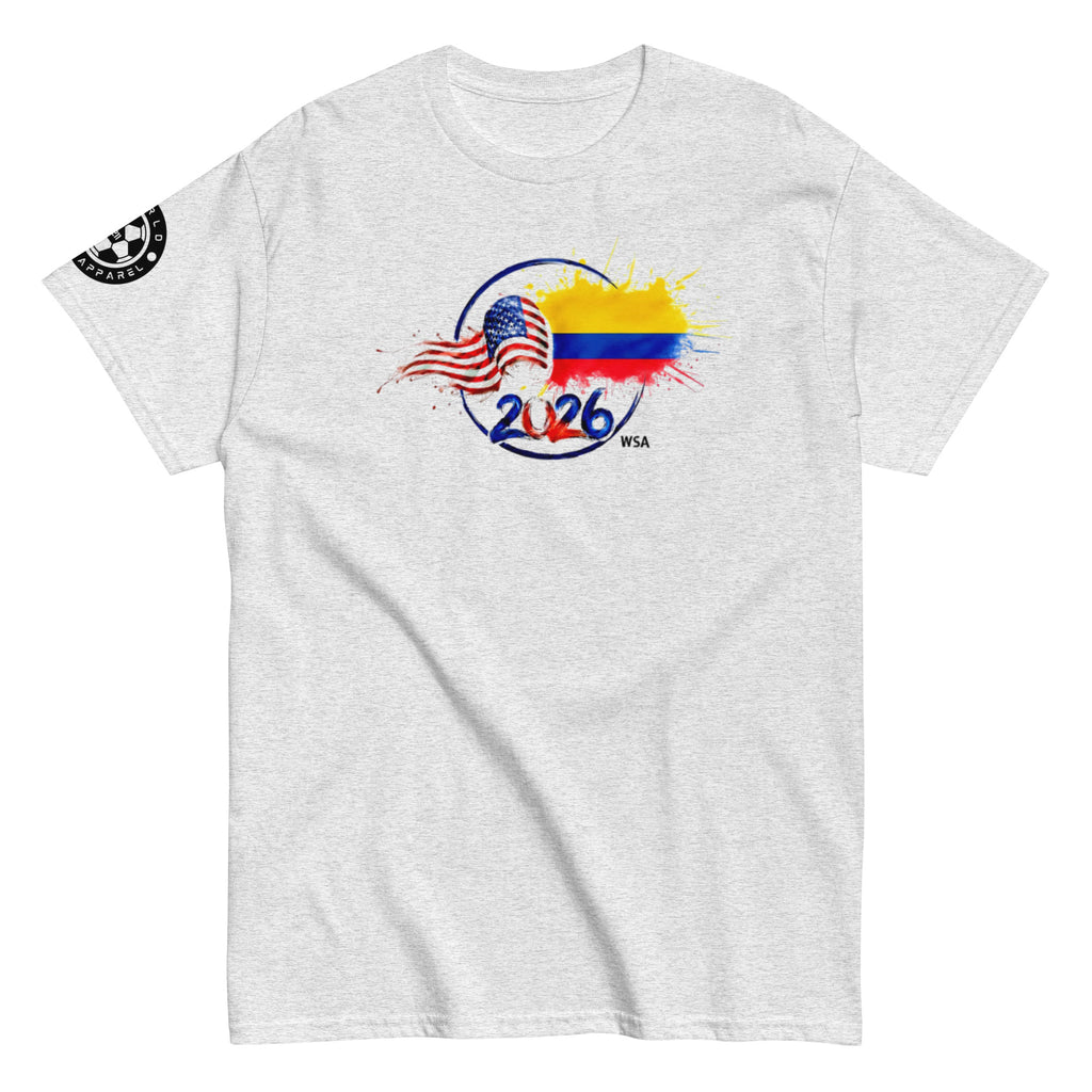 Gray t-shirt with a colorful graphic design featuring an American flag, Colombian flag, and '2026' on a white background.