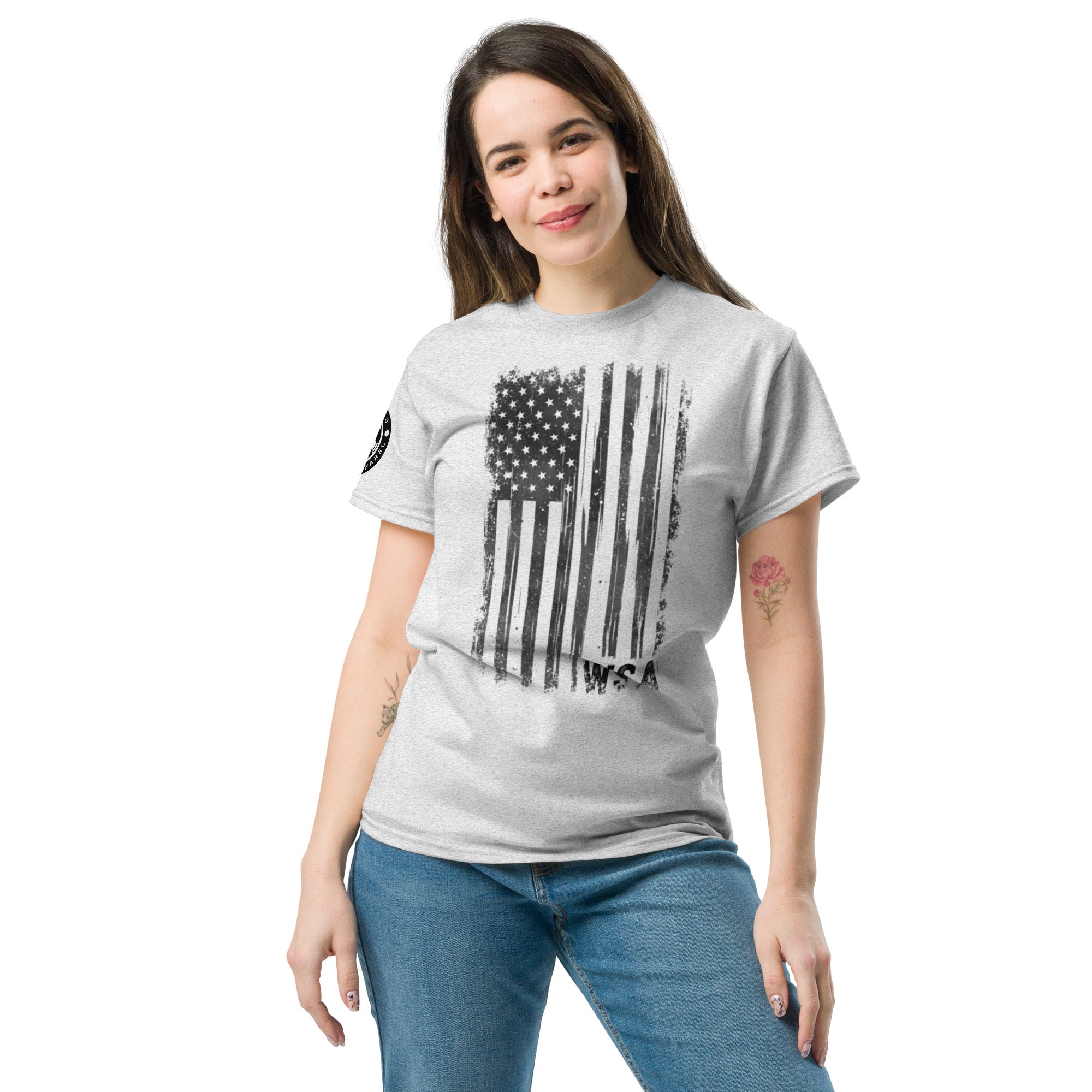 Woman wearing a gray t-shirt with an American flag design on a white background
