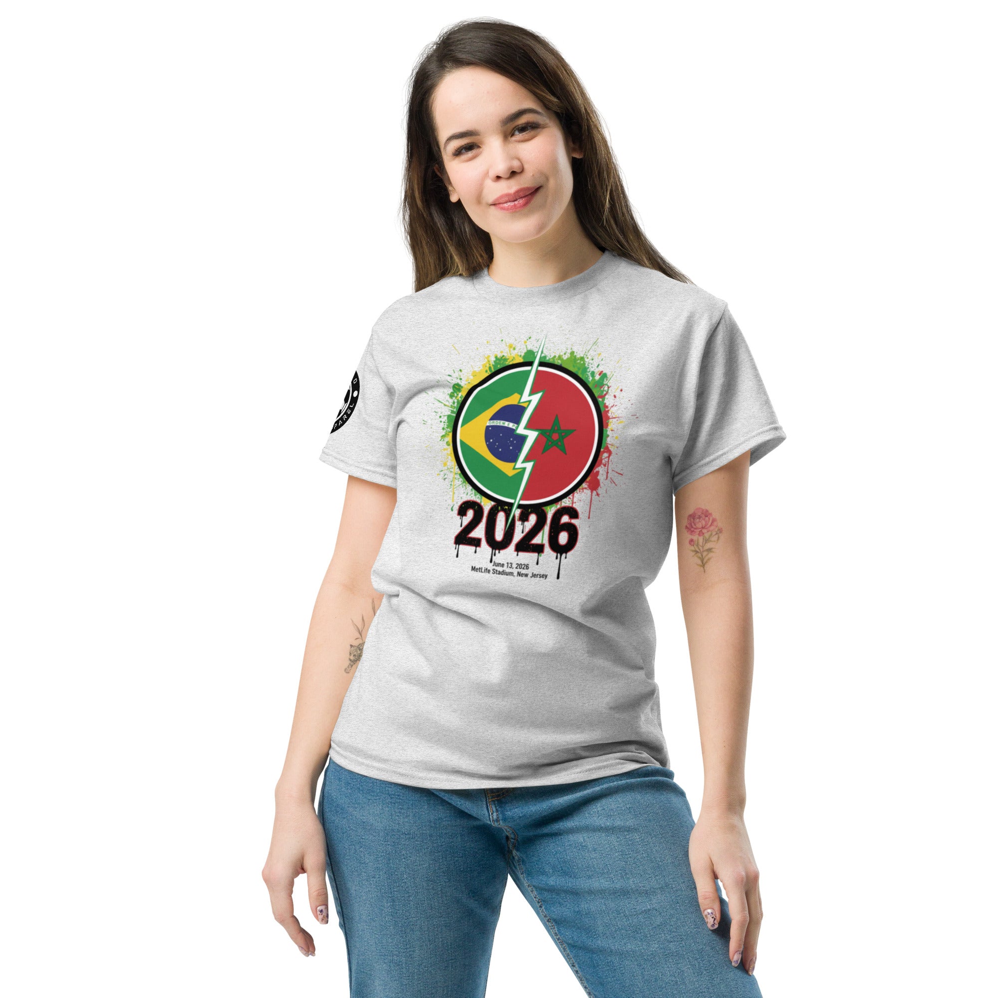 Woman wearing a gray t-shirt with a colorful design and '2026' text on a white background