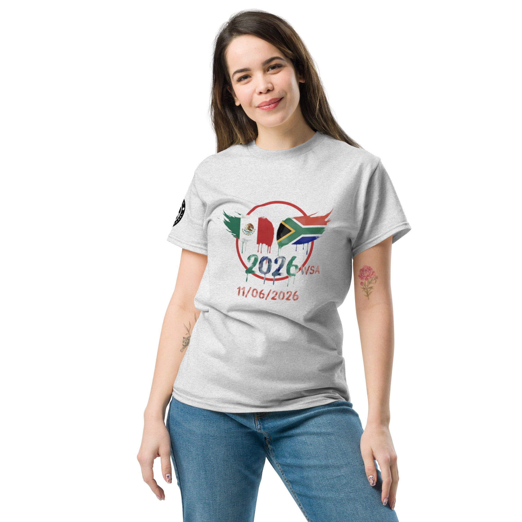 Woman wearing a gray t-shirt with a colorful design and text on a white background