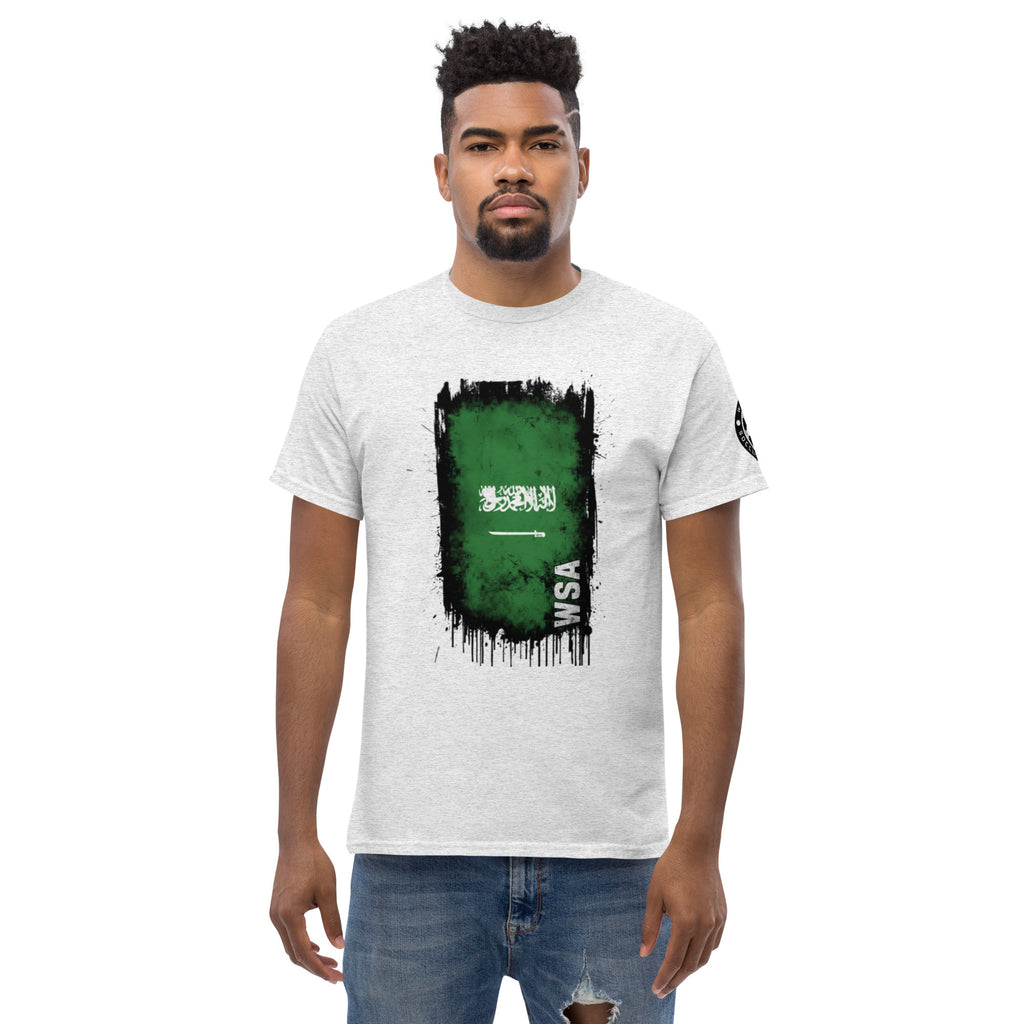 Man wearing a white t-shirt with a green and black graphic design on a white background