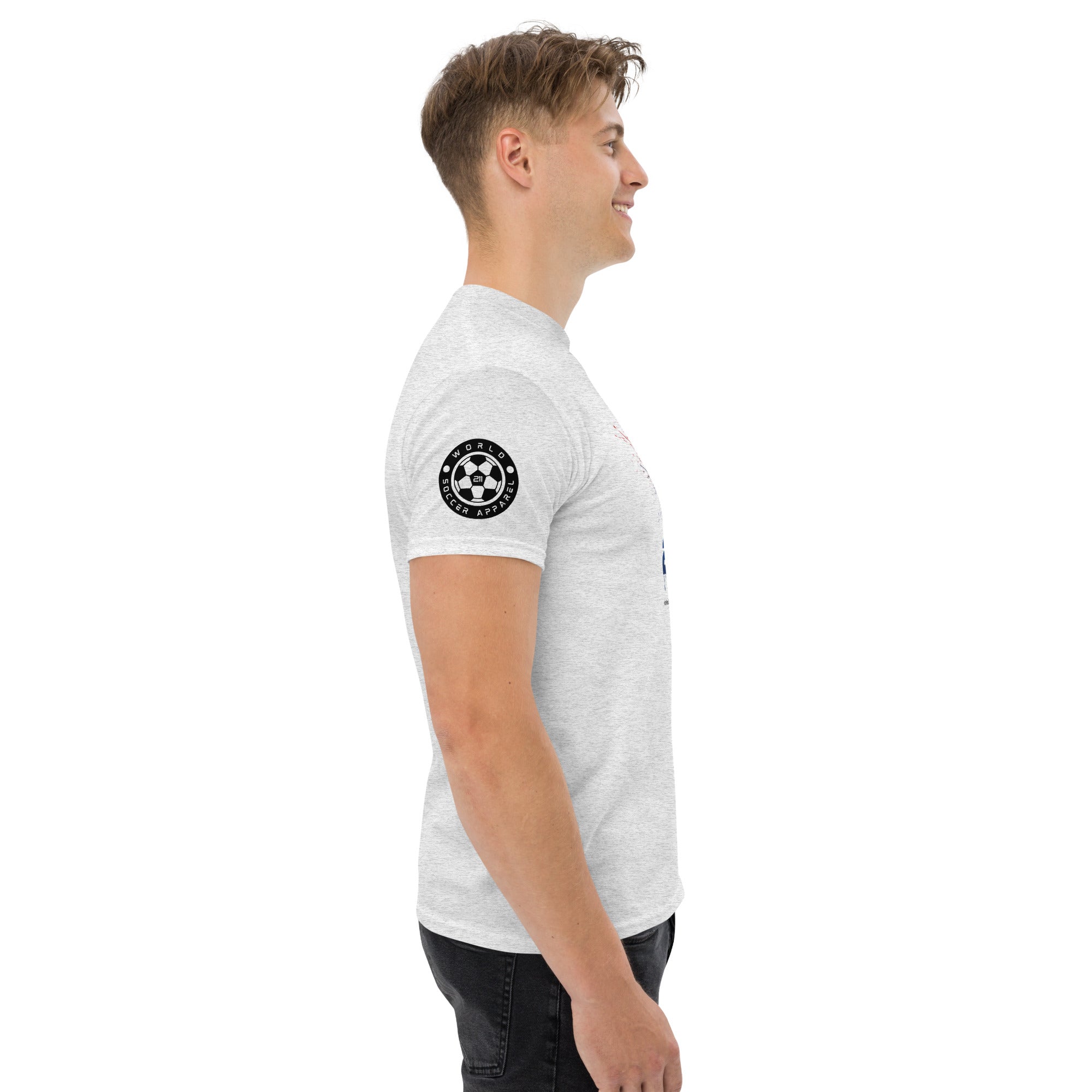 Man wearing a white t-shirt with a black circular design on the sleeve against a white background