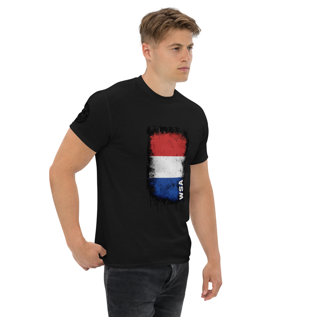 Man wearing a black t-shirt with a colorful graphic design on a white background