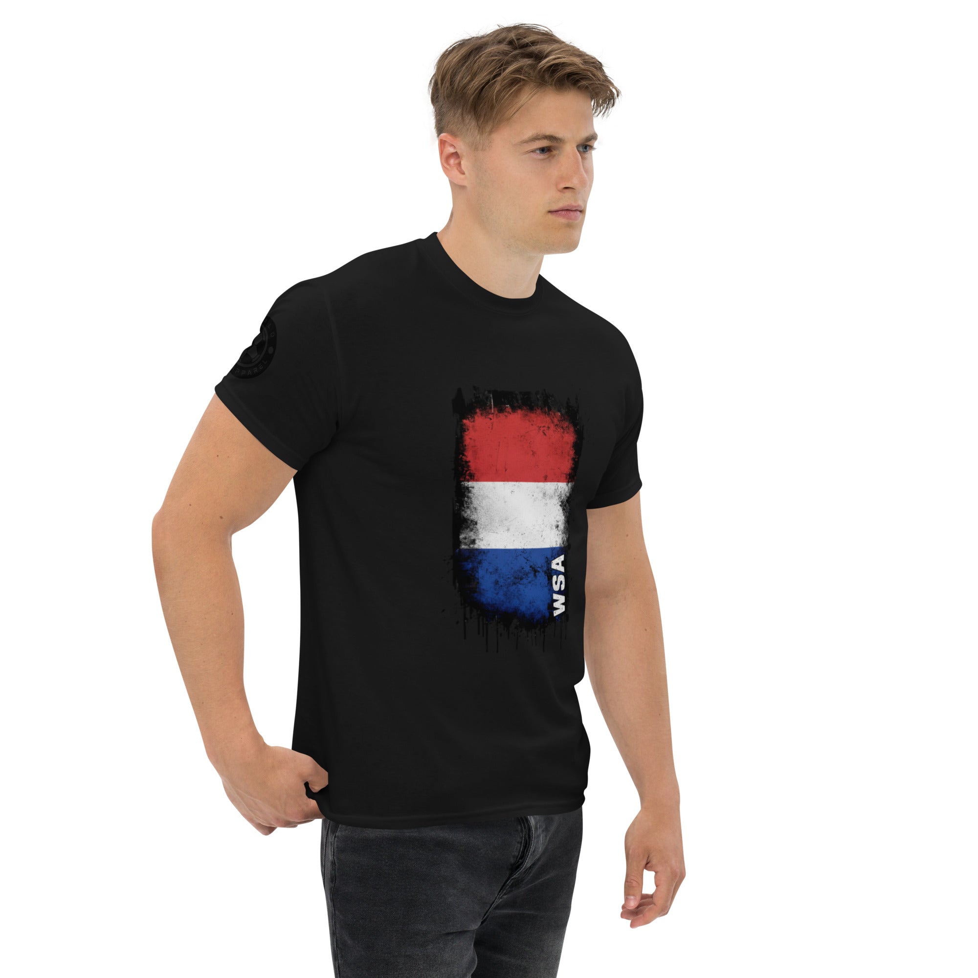 Man wearing a black t-shirt with a colorful graphic design on a white background