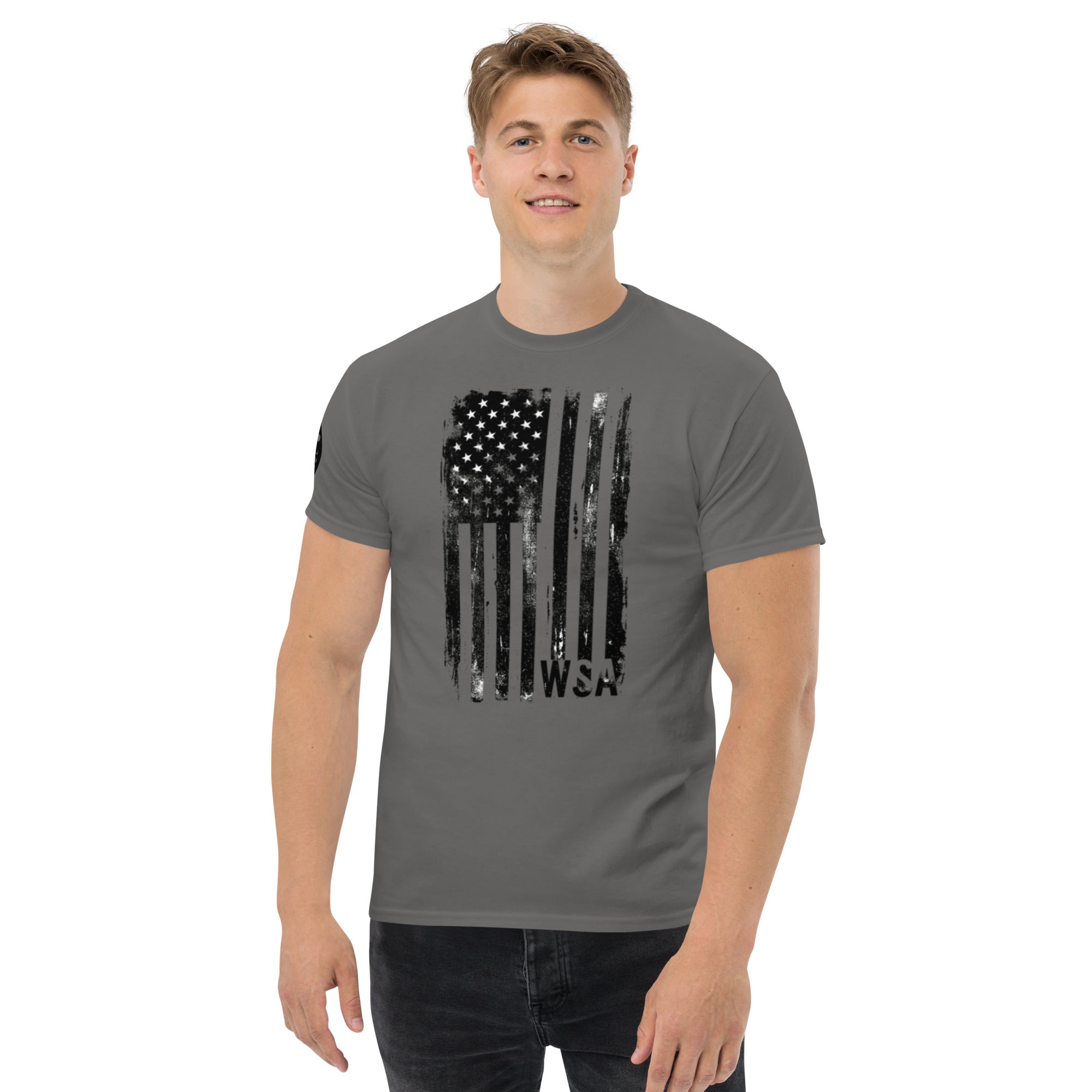Man wearing a gray t-shirt with a black American flag design on a white background