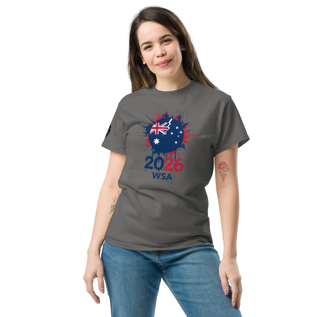 Woman wearing a gray t-shirt with a design featuring the number 2026 and text on a white background