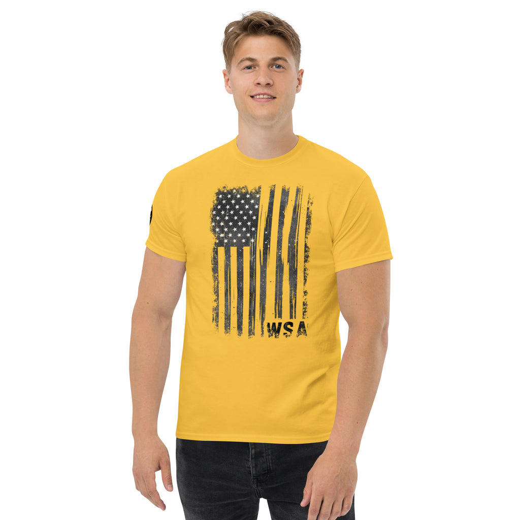 Man wearing a yellow t-shirt with a black flag design on a white background