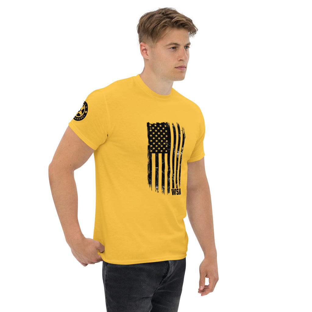 Man wearing a yellow t-shirt with a black graphic design on a white background