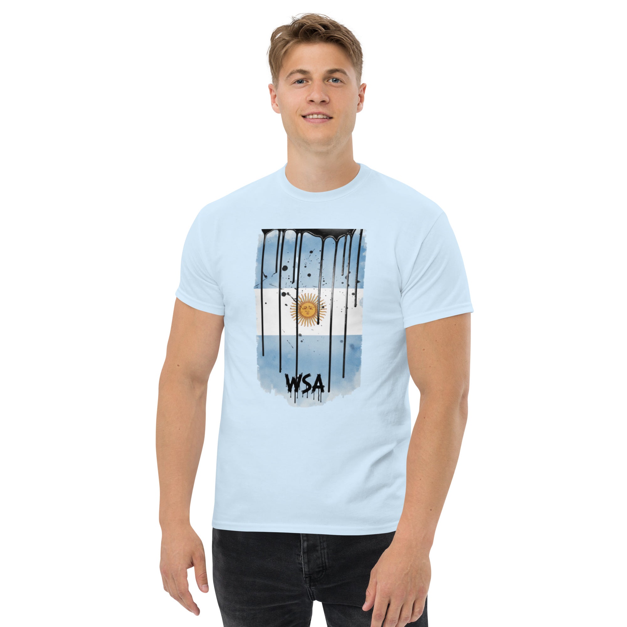 Person wearing a light blue t-shirt with a graphic design on a white background