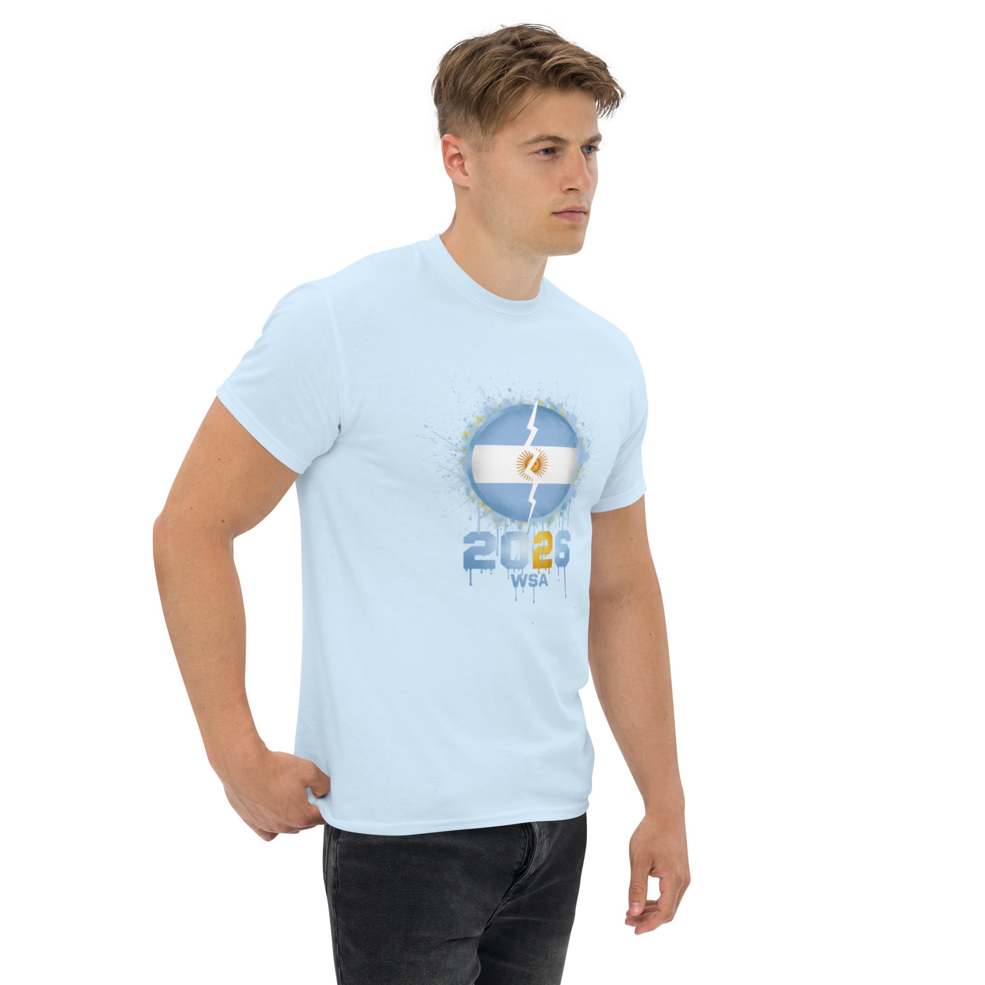 Man wearing a light blue t-shirt with a graphic design on a white background