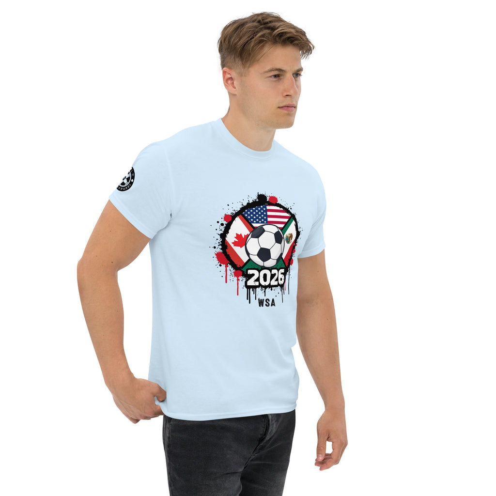 Man wearing a light blue t-shirt with a soccer-themed graphic design on a white background