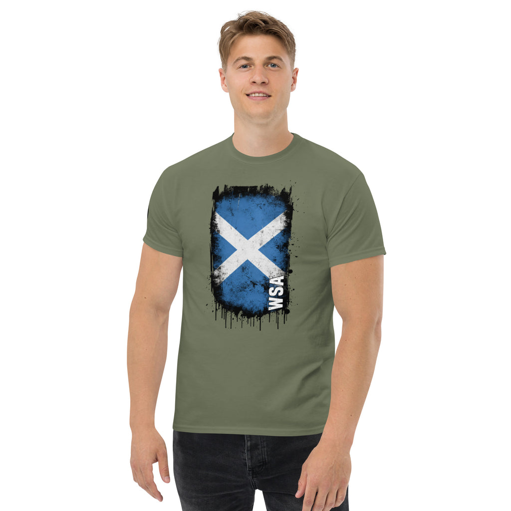 Man wearing a green t-shirt with a Scottish flag design on a white background