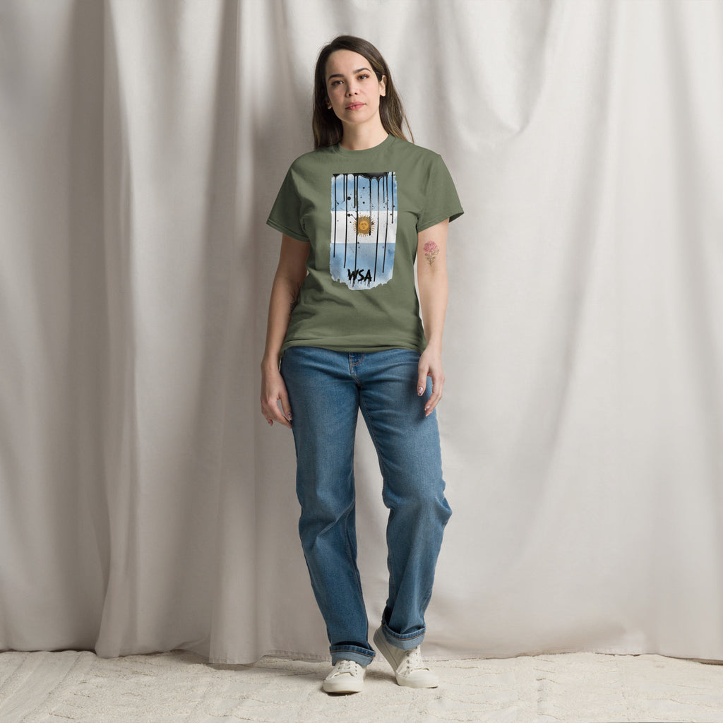 Person wearing a green t-shirt with a graphic design against a plain background