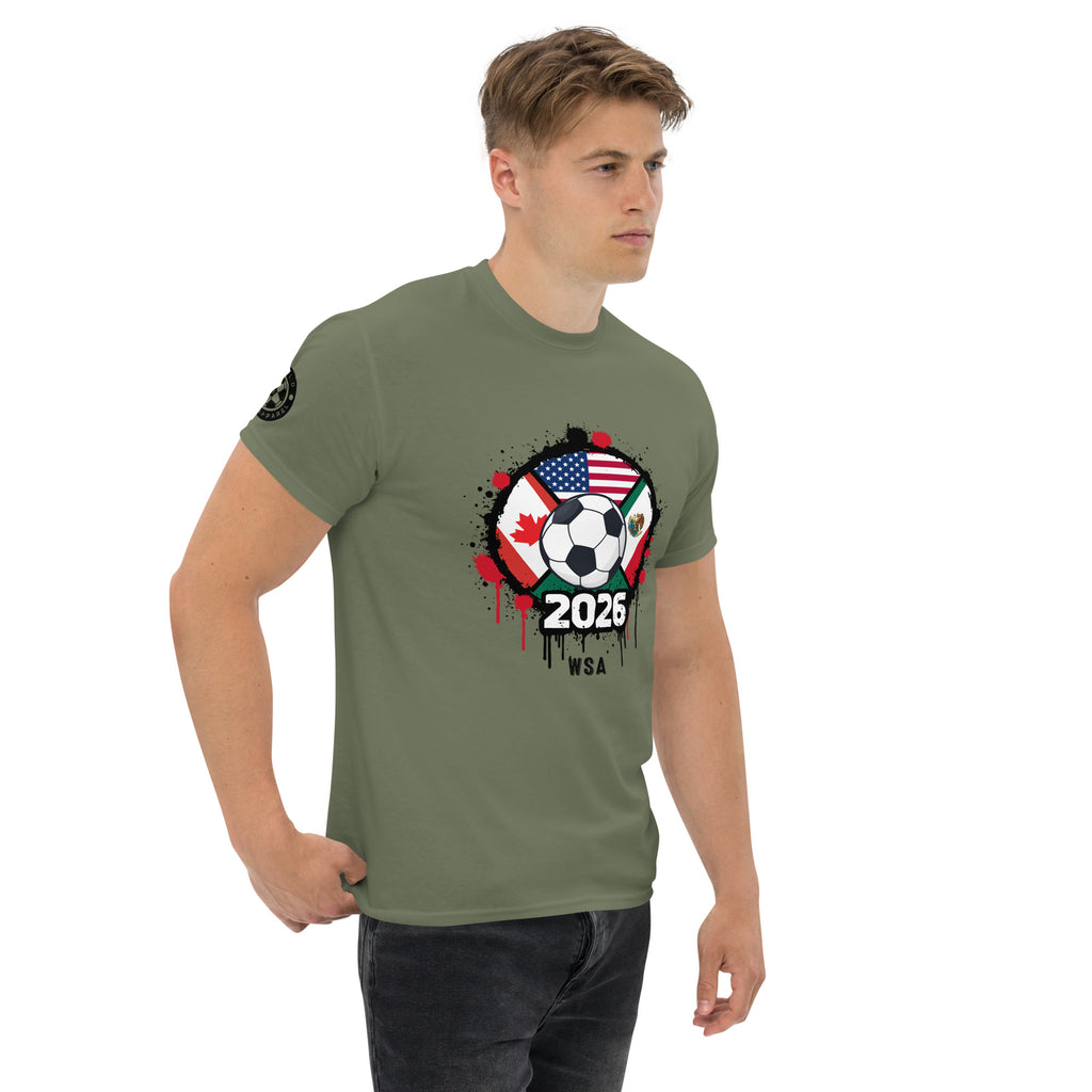 Man wearing a green t-shirt with a soccer-themed graphic design on a white background