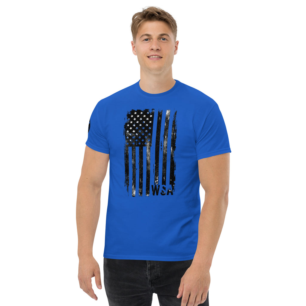 Man wearing a blue t-shirt with a black American flag design on a white background
