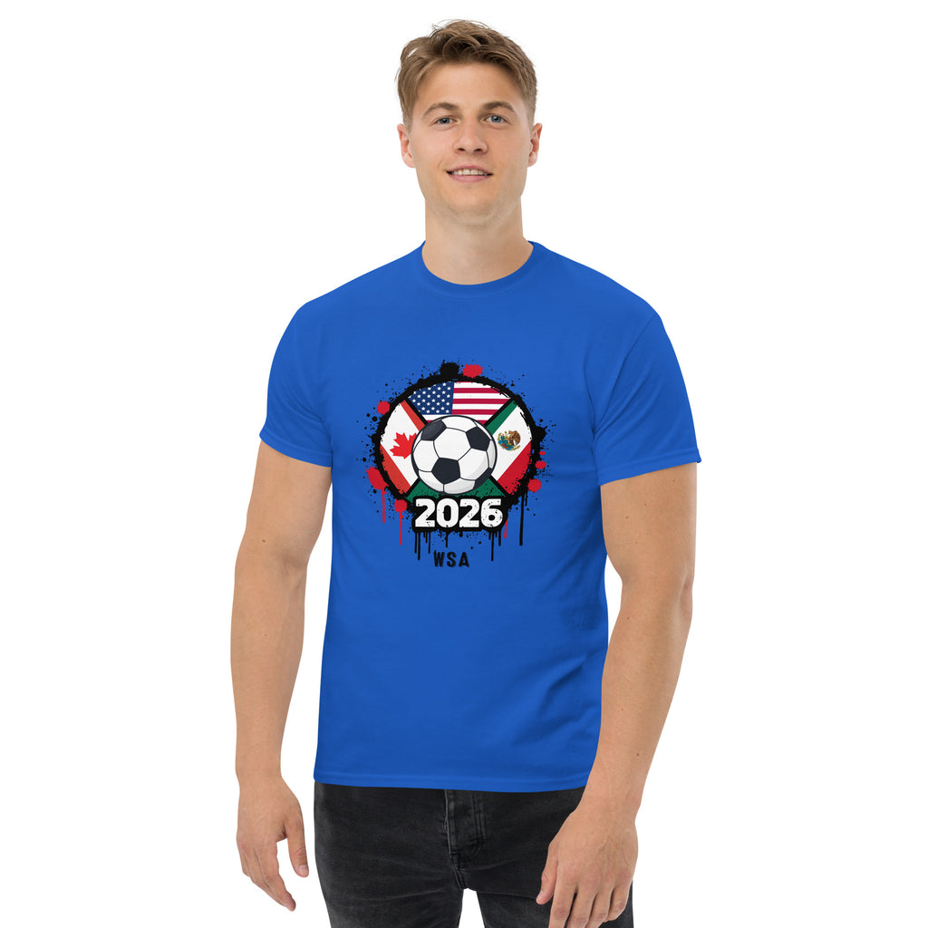 Person wearing a blue t-shirt with a soccer ball design featuring multiple flags and '2026 WSA' text on a white background.