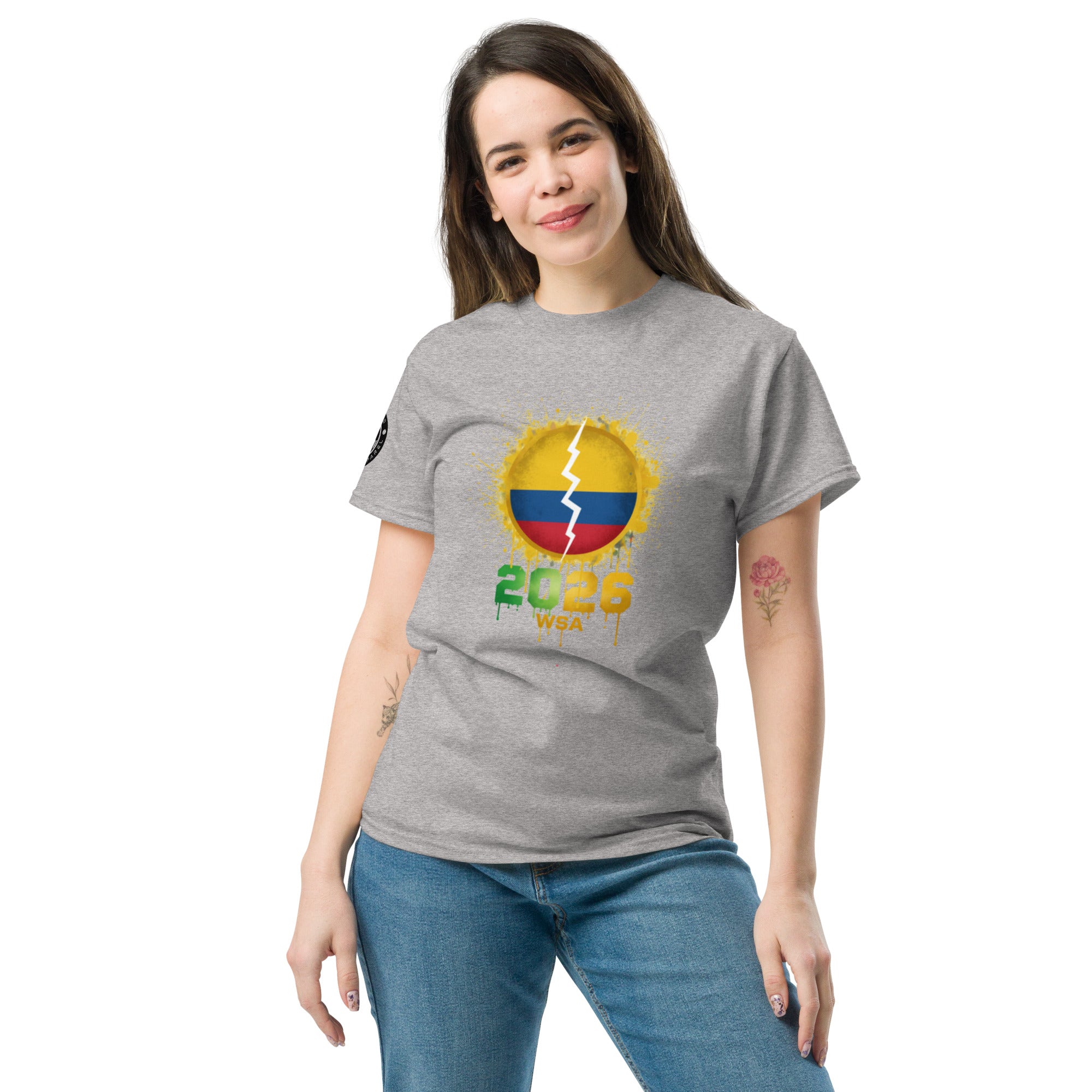 Woman wearing a gray t-shirt with a colorful design on a white background