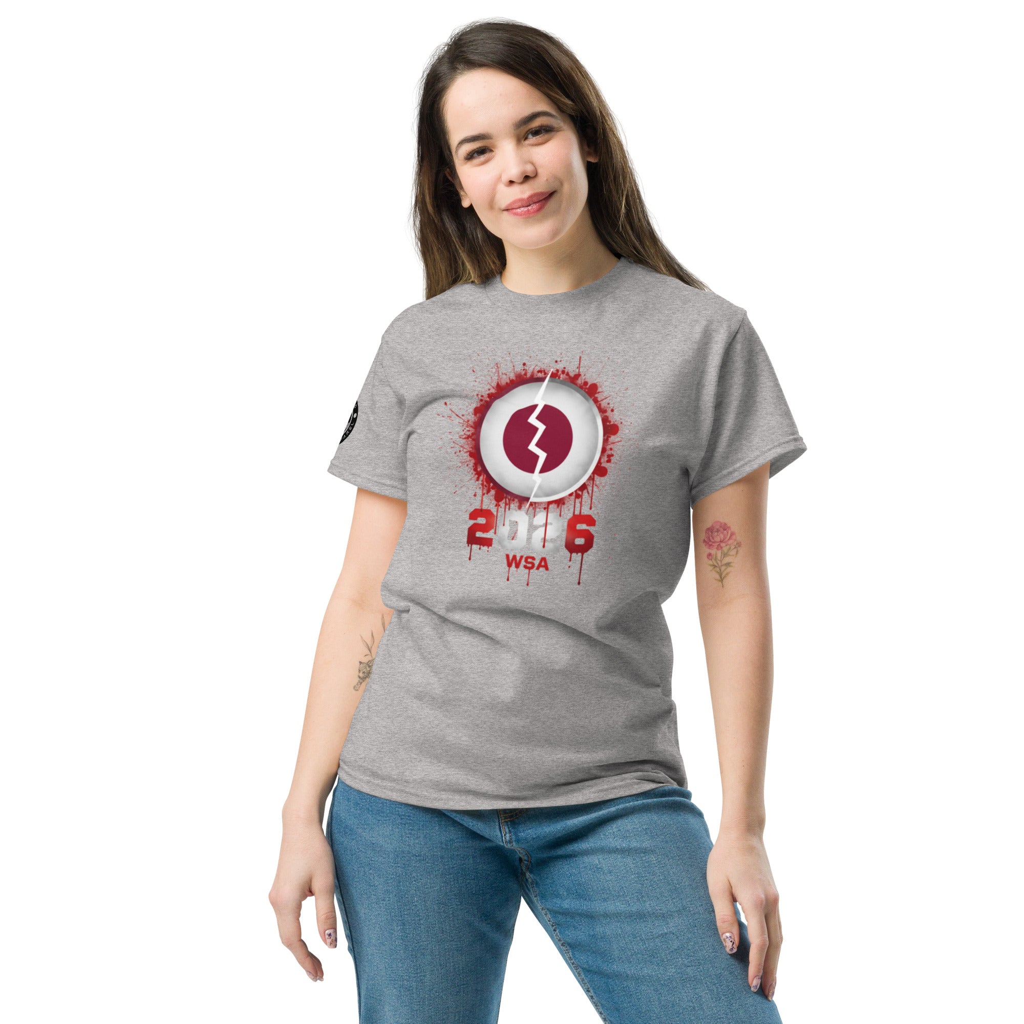 Woman wearing a gray t-shirt with a red and white graphic design on a white background