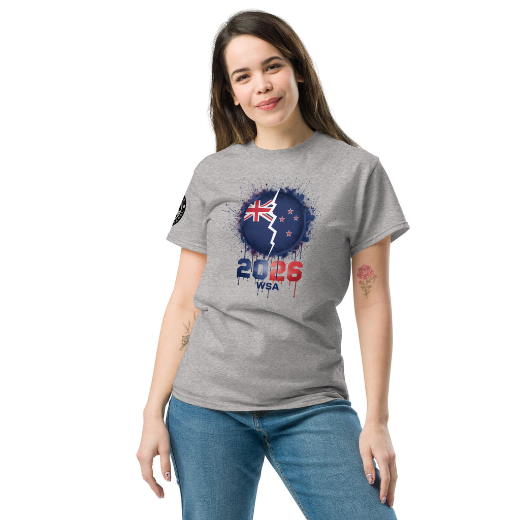 Woman wearing a gray t-shirt with a design featuring the number 2026 and a flag on a white background