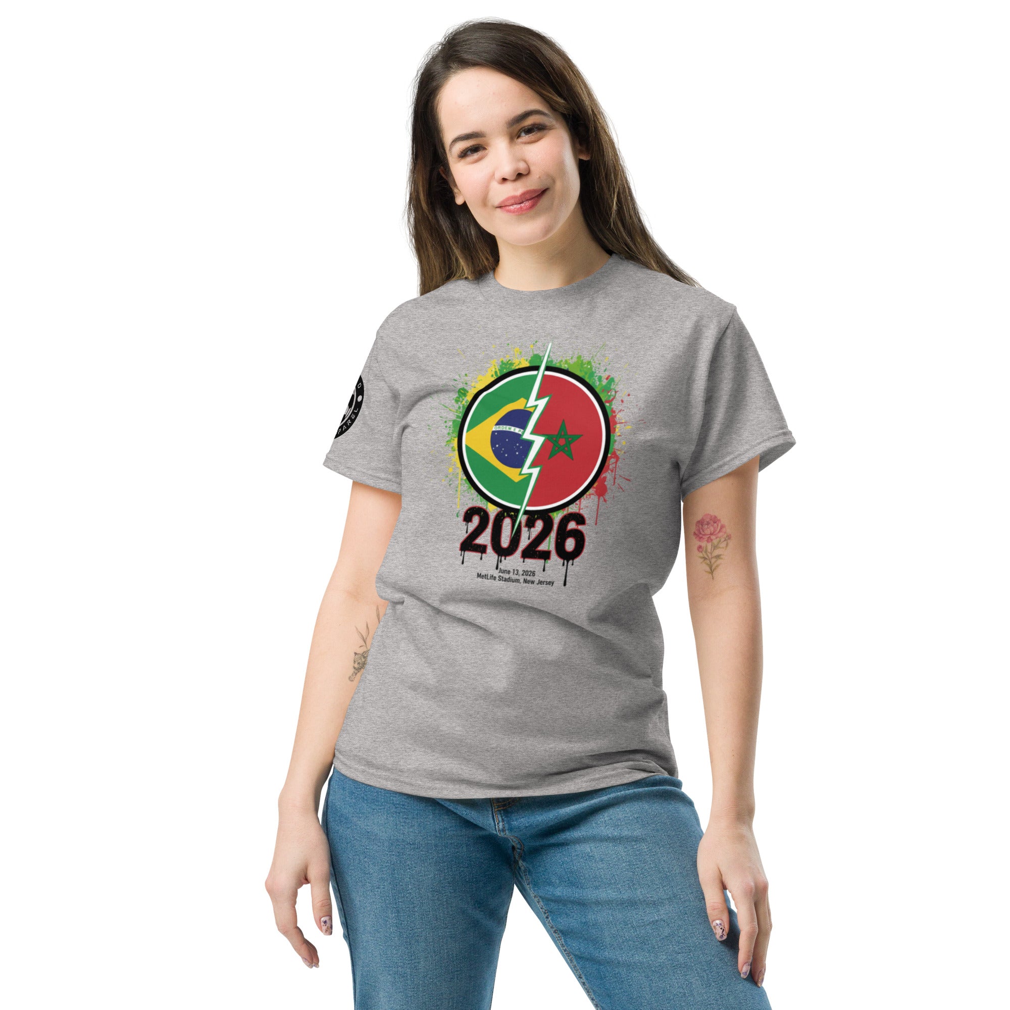 Woman wearing a gray t-shirt with a colorful design and '2026' text on a white background