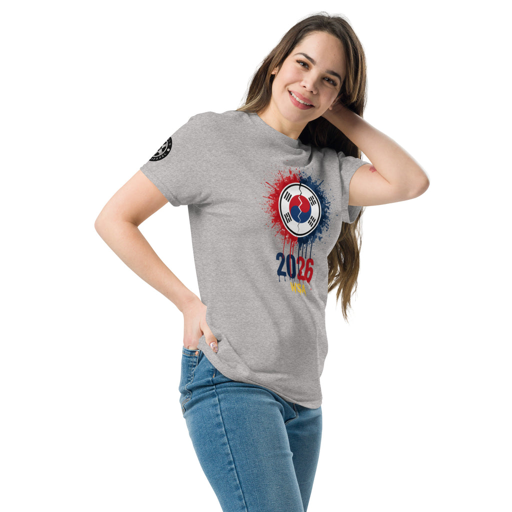 Woman wearing a gray t-shirt with a colorful design and '2026' text on a white background