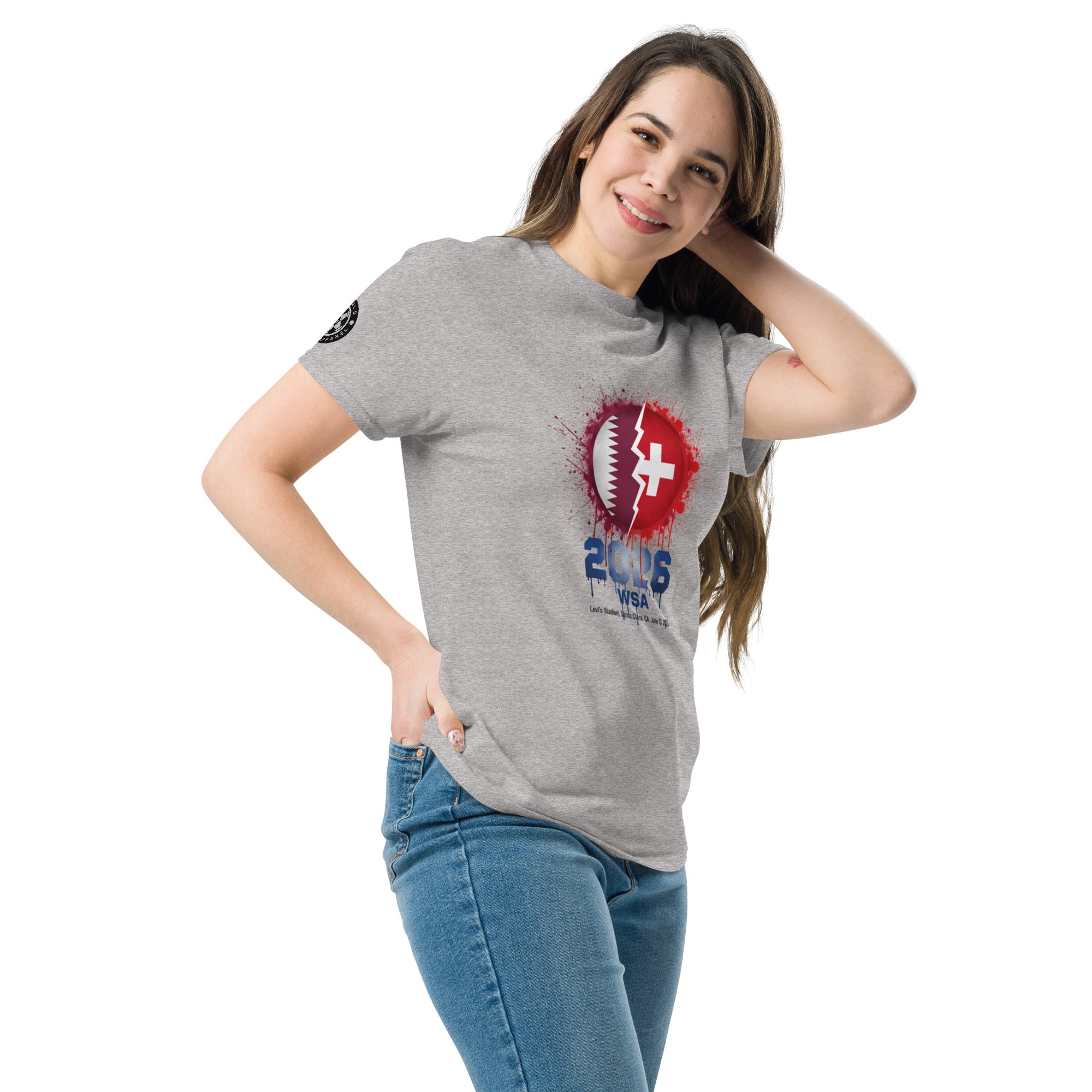 Woman wearing a gray t-shirt with a graphic design on a white background