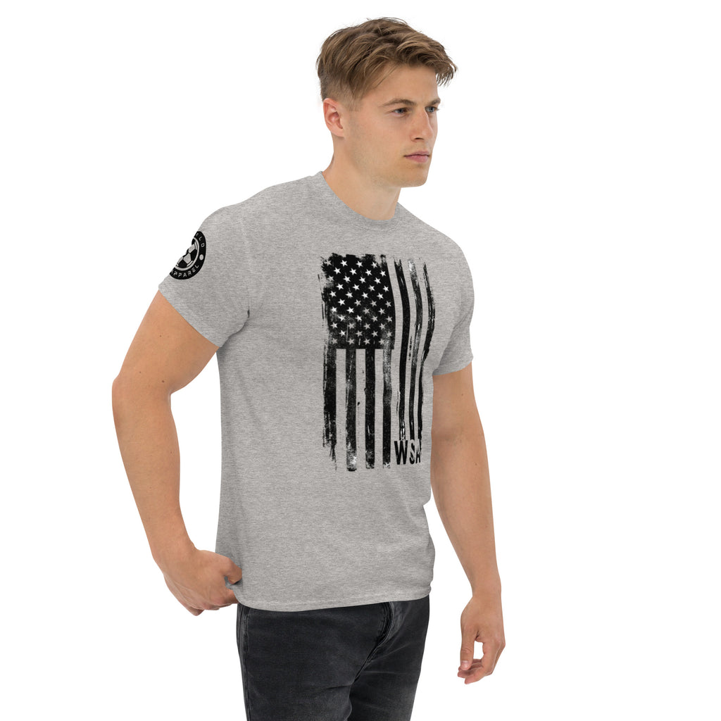 Man wearing a gray t-shirt with an American flag design on a white background