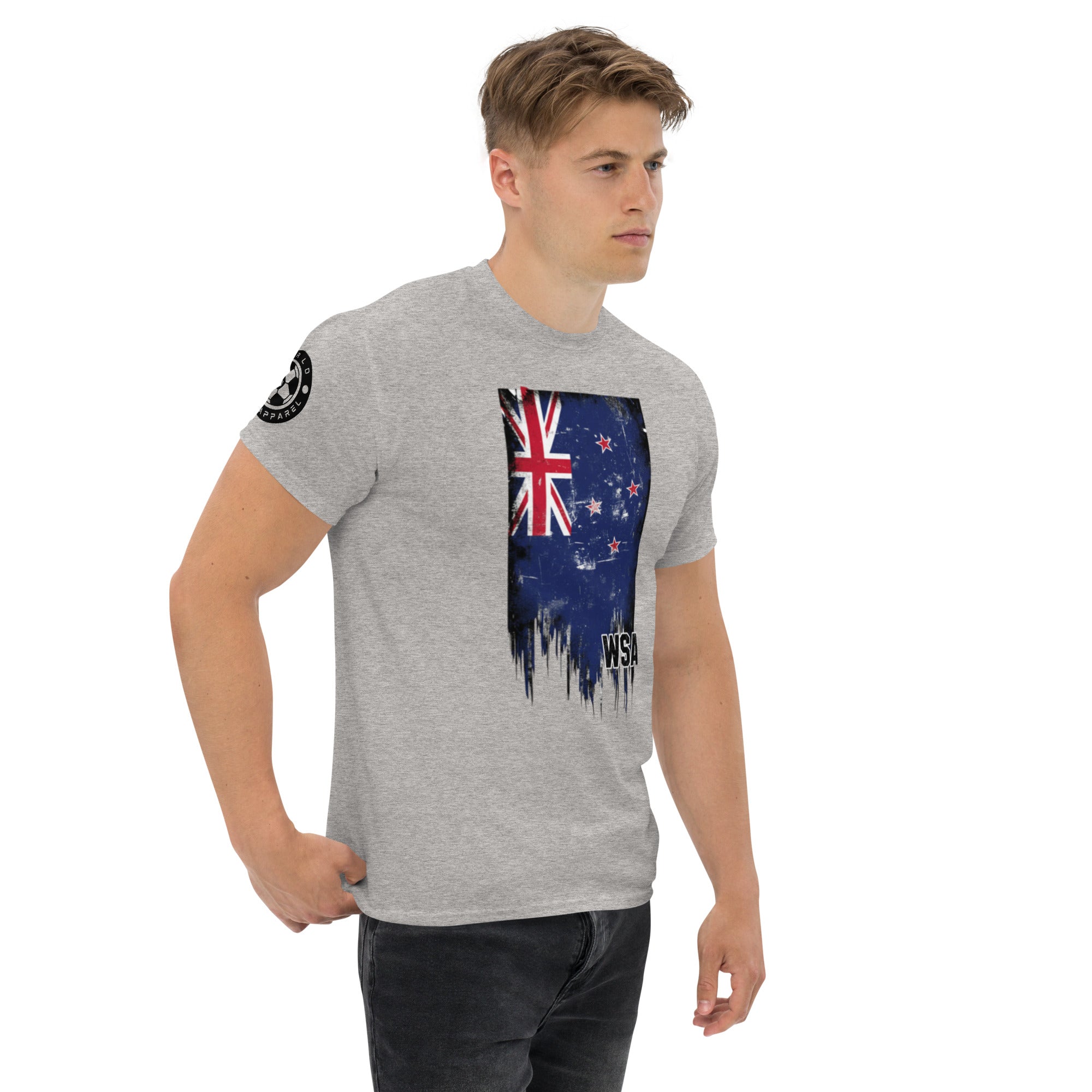 Man wearing a gray t-shirt with a graphic design on a white background