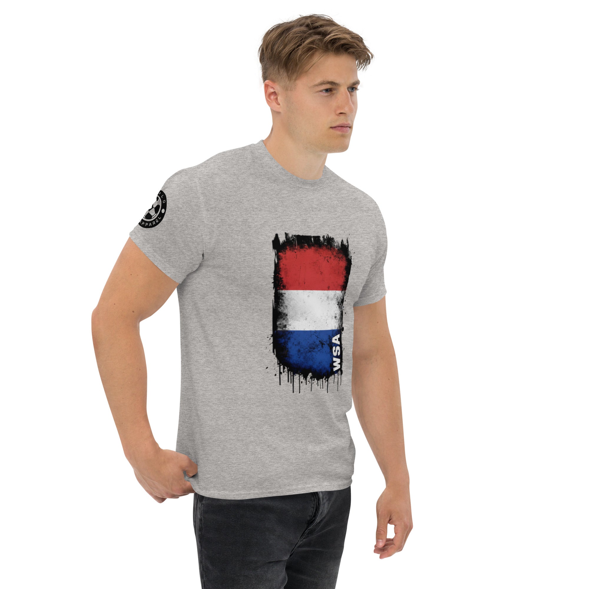 Man wearing a gray t-shirt with a colorful graphic design on a white background