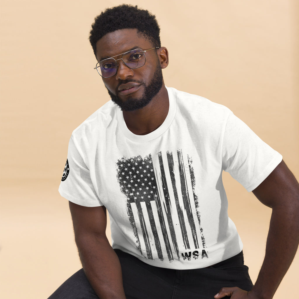 Man wearing a white t-shirt with an American flag design on a beige background