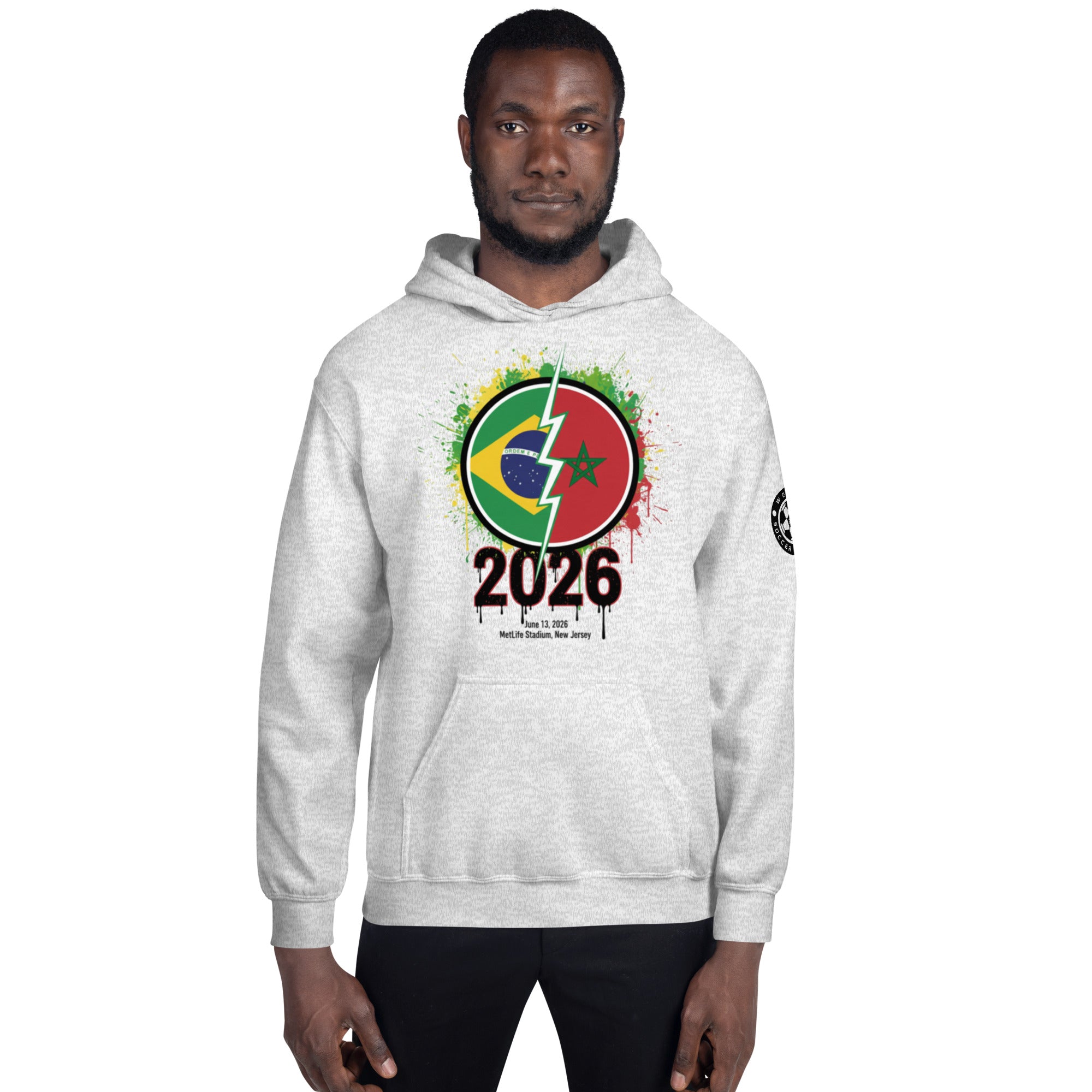 Person wearing a gray hoodie with a colorful design and '2026' text on a white background