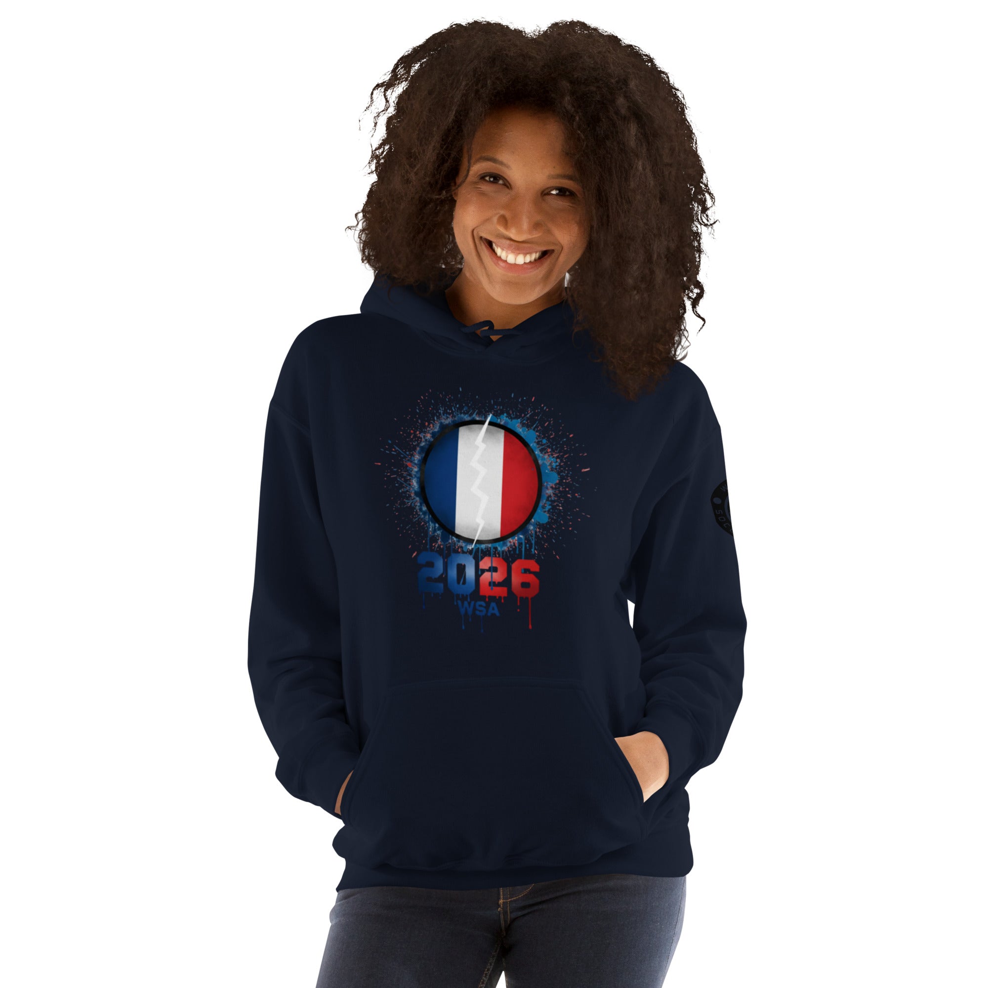 Person wearing a navy hoodie with a design featuring France's flag and '2026'