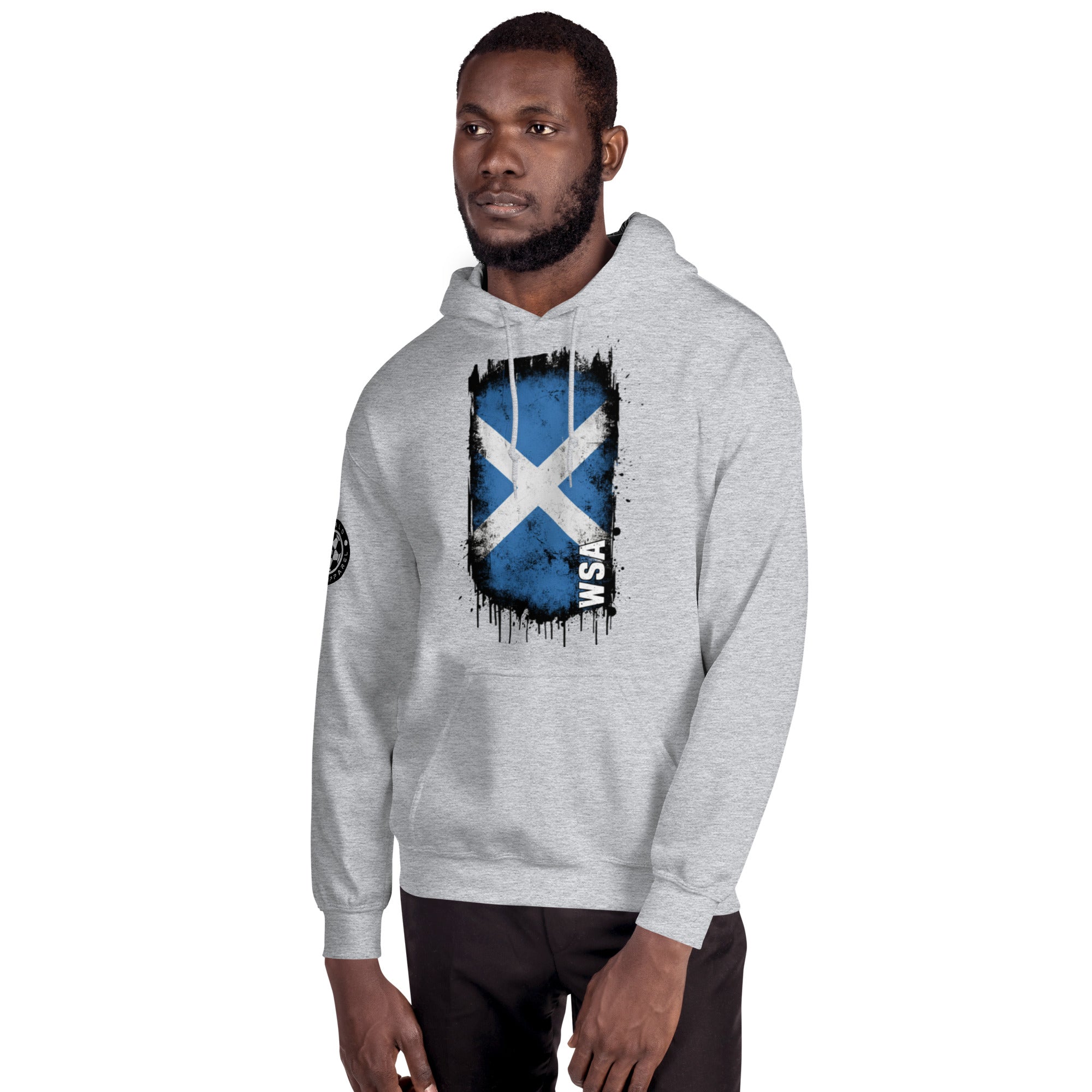Man wearing a gray hoodie with a Scottish flag design on a white background