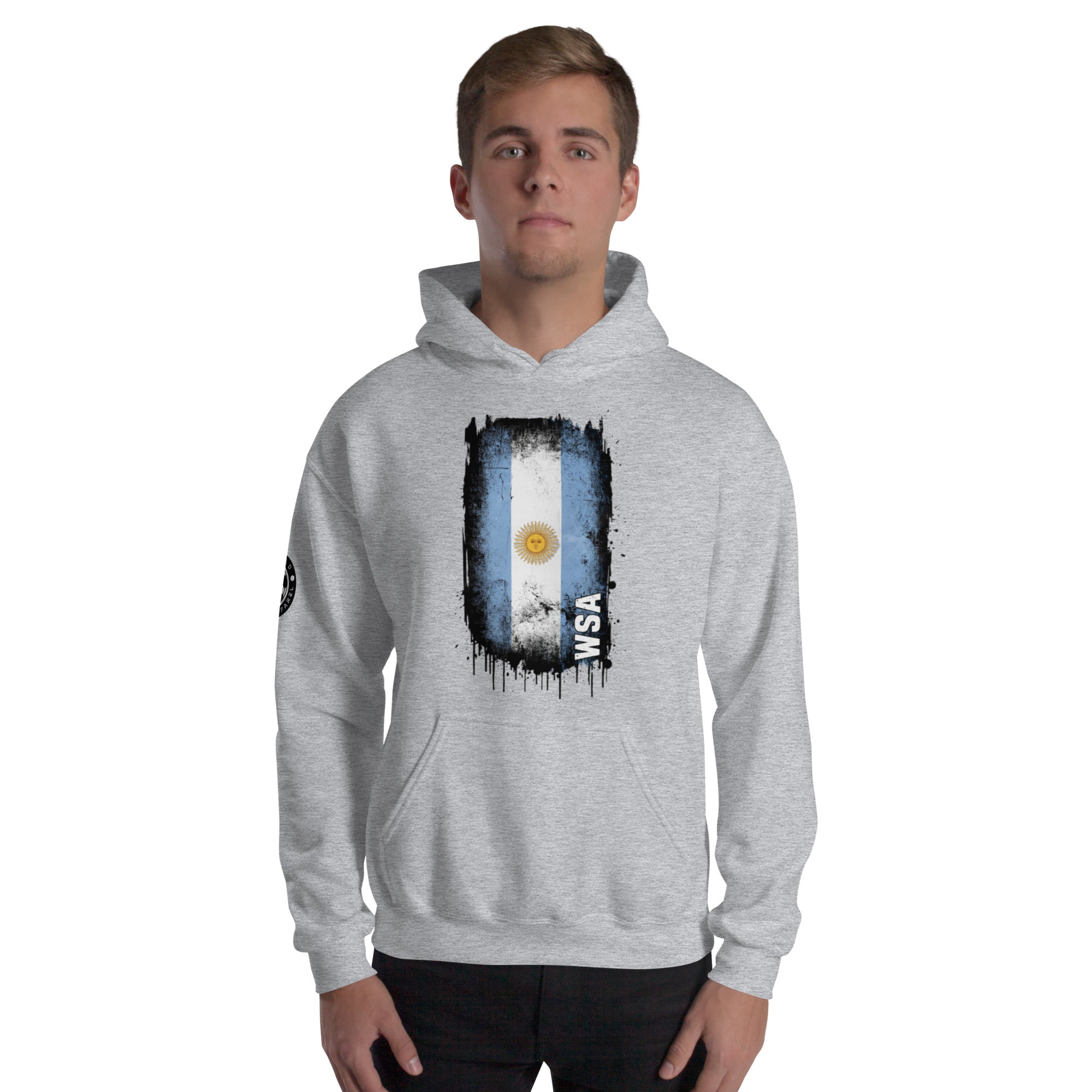 Person wearing a gray hoodie with a flag design on a white background