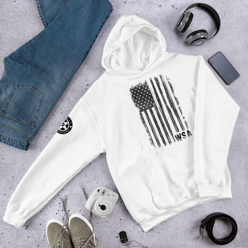 White hoodie with black flag design on a gray surface with jeans, shoes, and accessories.
