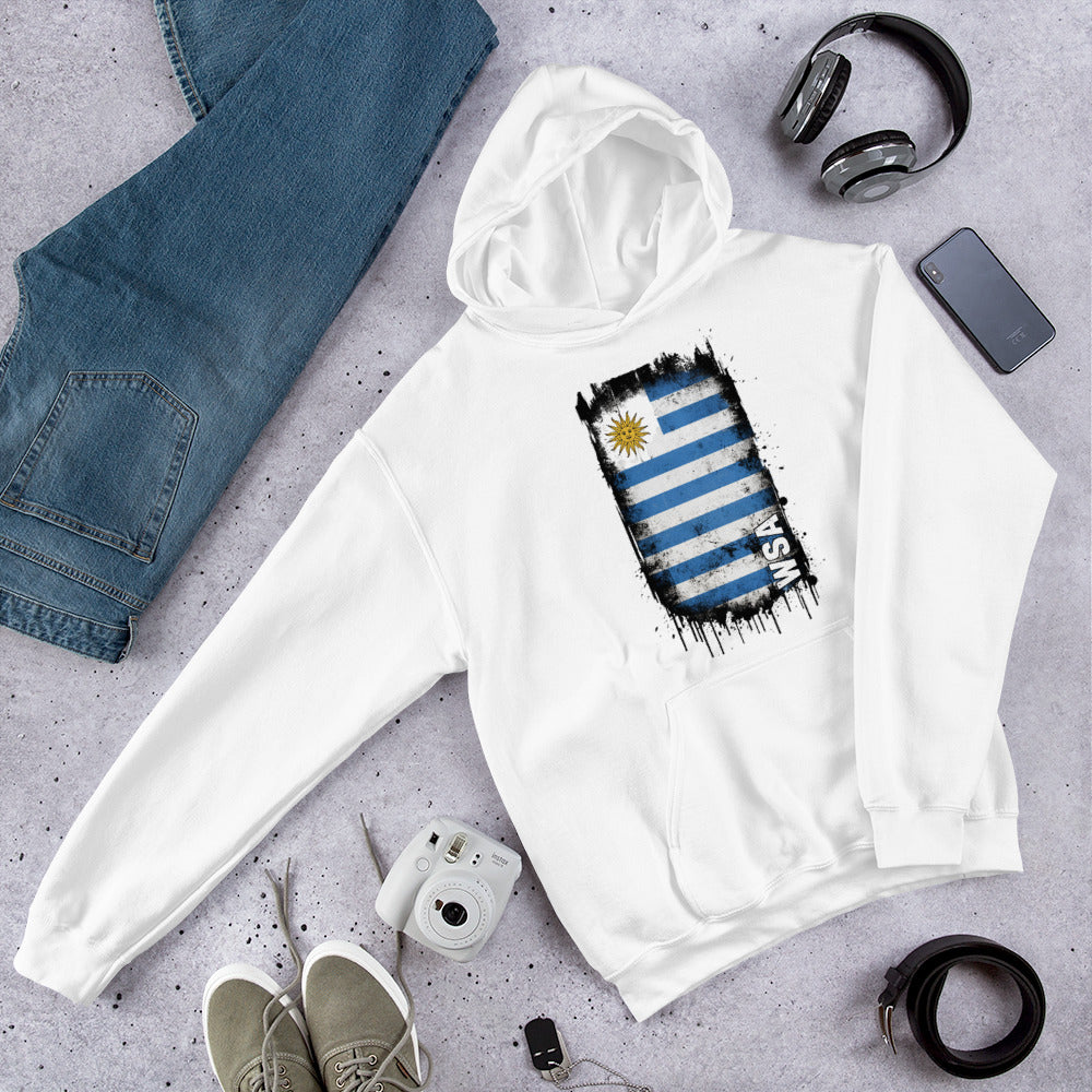 White hoodie with Uruguay flag design on a gray surface with jeans, shoes, and accessories.