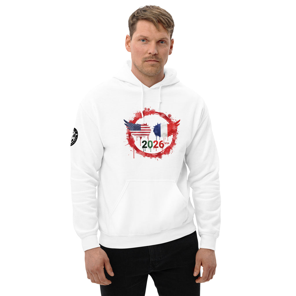 Man wearing a white hoodie with a design featuring the number 2026 and two flags on a white background