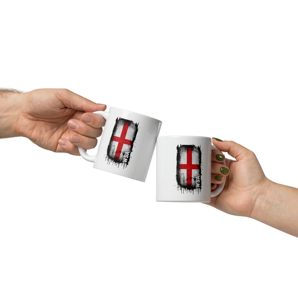 Two hands holding white mugs with a flag design on a white background