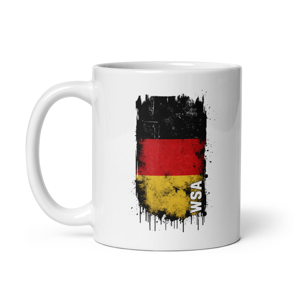 White mug with a design of a flag and 'WAS' text on a white background