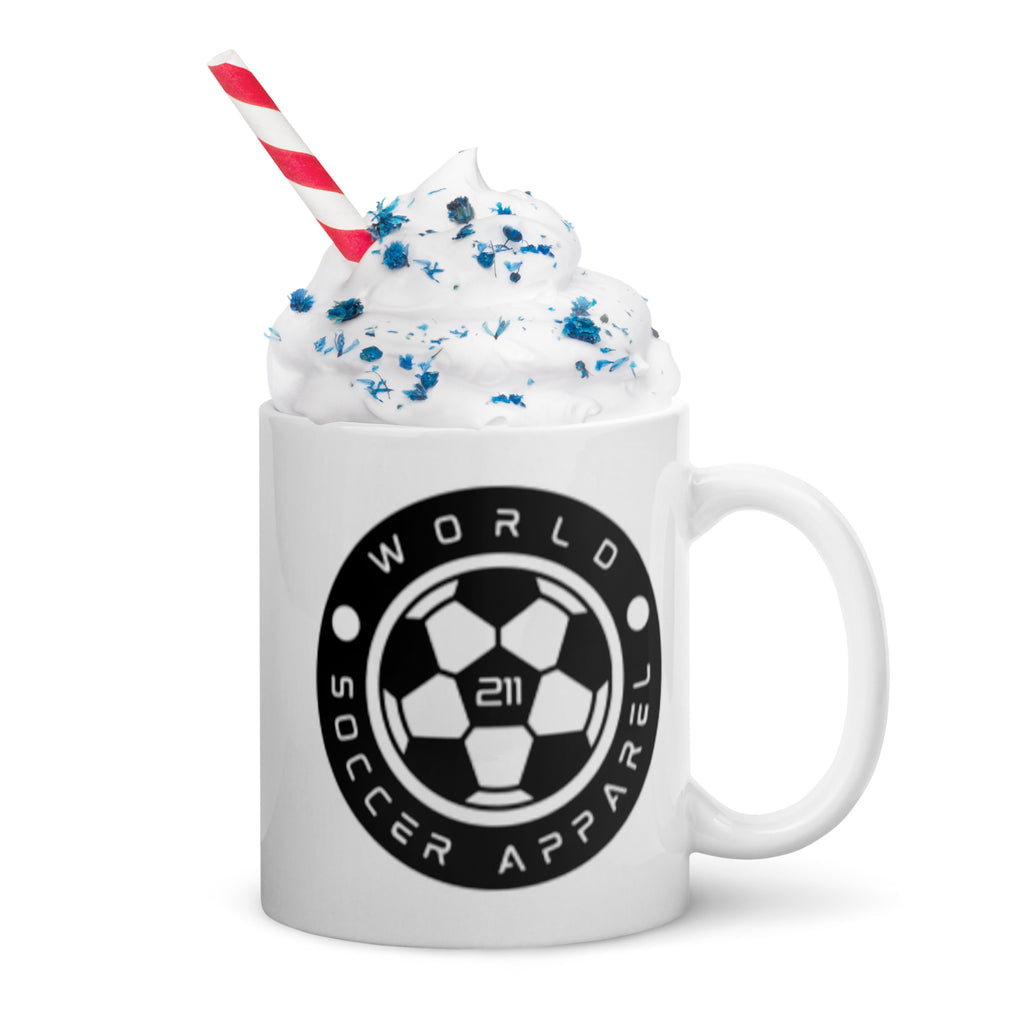White mug with World Soccer Apparel logo, filled with a milkshake and straw on a white background